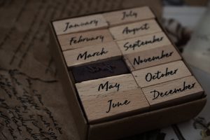 a close up of a wooden block with writing on it